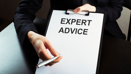 business woman showing paper sheet with text EXPERT ADVICE