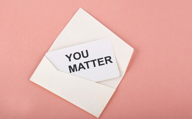 Word Writing Text You Matter on card on the pink background