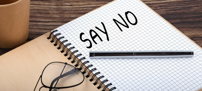 SAY NO words written in an office notebook. Concept in business.
