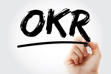 OKR - Objective Key Results acronym with marker, business concept background