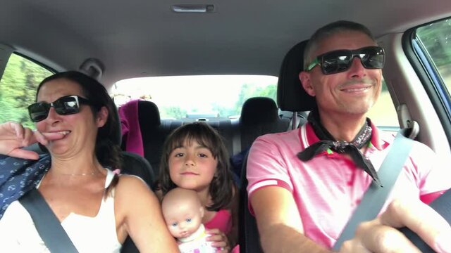 Happy family singing in the car