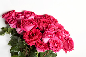 Bouquet of pink roses on white background with copy space