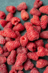 Fresh and sweet raspberries as background. Texture of raspberries close up. Vegetarian concept.