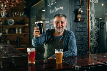 bartender serving beer in pub