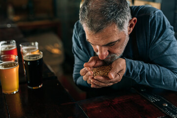 bartender serving beer in pub