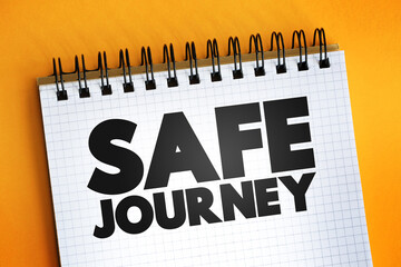 Safe Journey text quote on notepad, concept background