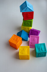 Multi-colored silicone cubes for children for games. Isolate