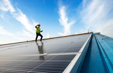 Male Engineer Inspects Solar Panels on Hospital Building Roofs, Solar Panel Maintenance Inspector