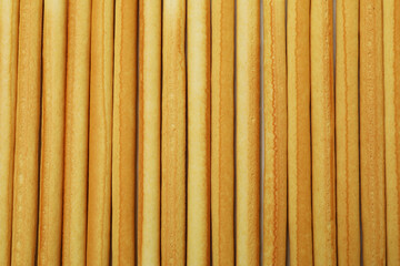 Grissini breadsticks on white background, close up