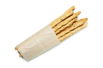 Craft paper with grissini breadsticks isolated on white background