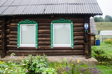 Fototapeta na wymiar Russian Old Believers village in Latvia, Slutiski. Beautiful wooden house.