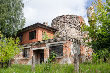 Abandoned house attached to a windmill