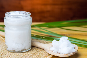 Unrefined coconut oil on a wooden spoon