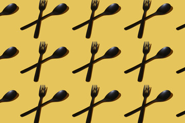 repeated samples of cutlery on a yellow background - 424163966