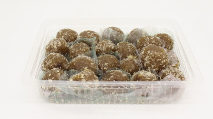 Amla Ladoo, pure and health sweets which use for traditional and regular use amla laddoo contain of natural amla and sugar, garnesing with coconut.