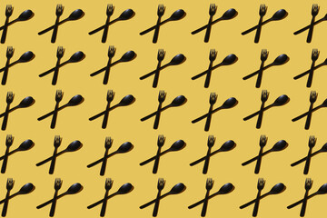 repeated samples of cutlery on a yellow background - 424164565