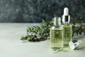 Obraz na płótnie Canvas Concept of natural cosmetics with eucalyptus oil on white textured table