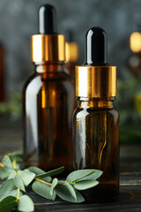 Concept of natural cosmetics with eucalyptus oil on wooden table