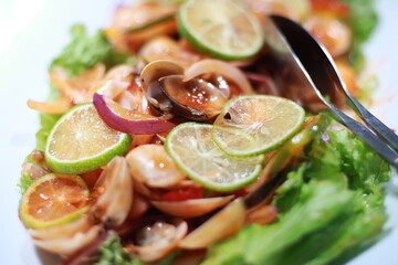 seafood salad with lime slices and onions