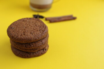 The cookie homemade oatmeal lies a stack of slides on a yellow bright background with room for text and copyspace