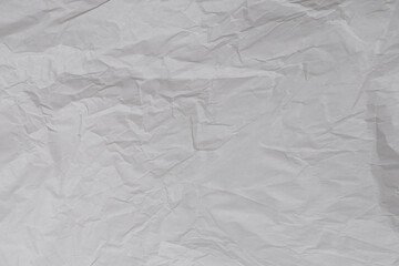 Crumpled white paper background.