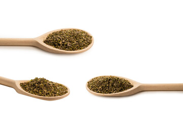 Oregano spice in wooden spoon isolated.