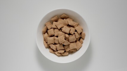 Chocolate breakfast pads in white deep bowl, Top view