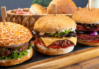 Tasty vegetarian cheeseburgers and hamburgers with round patties or burgers made from grains, vegetables and legumes