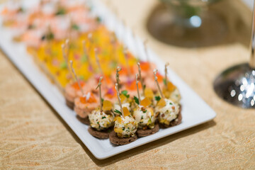 buffet food, catering food party at restaurant, mini canapes, snacks and appetizers