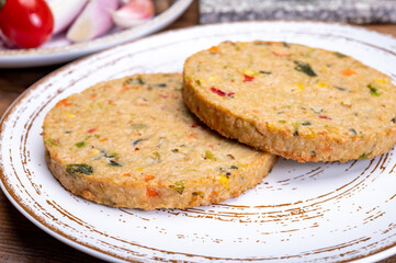 Round vegetarian patties or burgers made from grains, vegetables and legumes