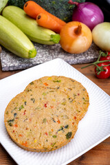 Round vegetarian patties or burgers made from grains, vegetables and legumes