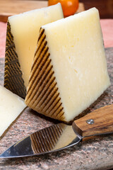 Cheese collection, pieces of hard Spanish manchego curado, viejo and iberico cheeses