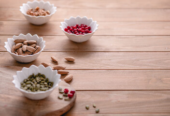 Obraz na płótnie Canvas Healthy snacks. Variety of superfood: nuts, berries, grain, seed