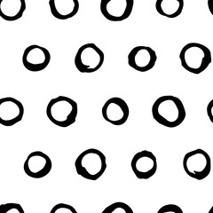 Hand drawn seamless vector pattern with abstract black circles. Trendy vector background for prints, textile and wallpaper. Modern backdrop in grunge style in black and white