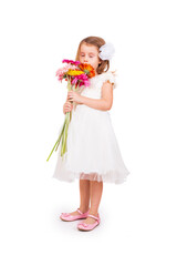 Cute little girl with flowers on white background