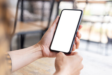 cell phone blank white screen mockup.woman hand holding texting using mobile on desk at office.background empty space for advertise.work people contact marketing business,technology