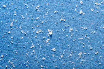 Fine house dust in soft focus under high magnification