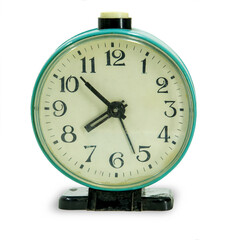 Green vintage alarm clock isolated on white background.