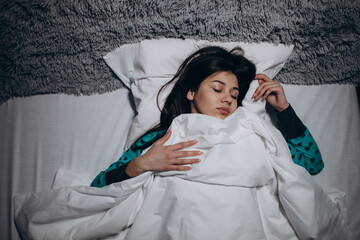 Beautiful woman dreaming at night