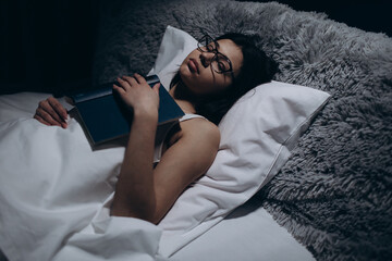 Woman sleeping with book