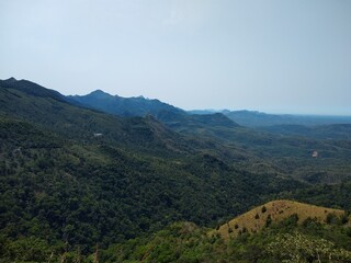 Fototapeta premium beautiful mountain and valley in Western ghats, Ponmudi Hill Station Thiruvananthapuram Kerala, landscape view