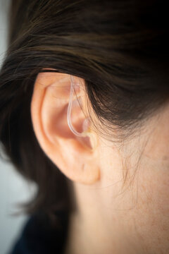 Hearing aid ear of woman