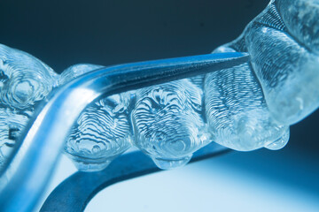 Invisible bracket aligners
