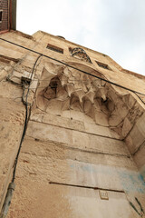 The facade  of a residential building decorated with decorative stucco in the Arabian style, in the...