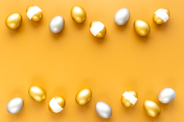 Golden and silver eggs frame. Wealth and good luck concept. Easter decoration