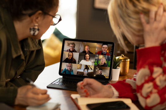 Female coworkers having video call