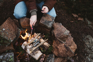 Woman preparing campfire