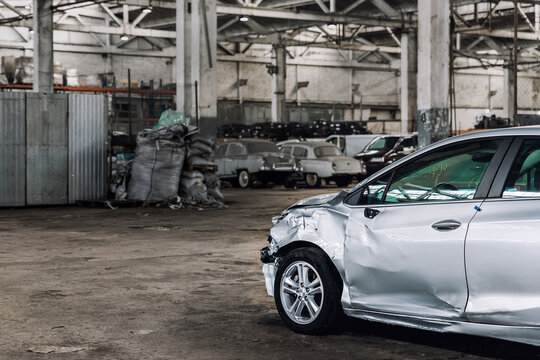 Many Unknown Altered Wrecked Car After Traffic Accident Crash At Restore Service Maintenance Station Garage Indoor. Insurance Salvage Vehicle Auction Wholesale. Auto Body Wreck Damage Workshop Center