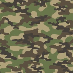 Fototapeta premium camouflage green texture with black spots seamless pattern. Vector trendy design.