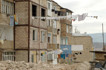 Deserted landscape with bombed houses in Nagorno Karabakh after war
